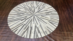 Handmade Starburst Cowhide Rug: Round Patchwork Leather Carpet with Wool Backing - Alef home