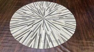 Handmade Starburst Cowhide Rug: Round Patchwork Leather Carpet with Wool Backing - Alef home