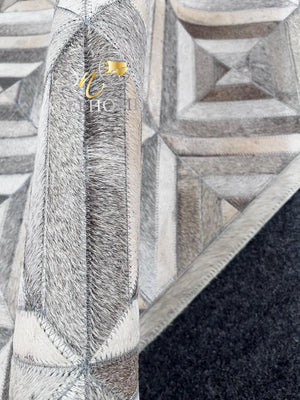 Handmade Grey Cowhide Patchwork Rug: Geometric Hair-On Leather - Alef home