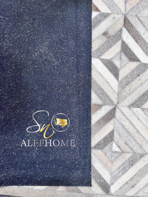Handmade Grey Cowhide Patchwork Rug: Geometric Hair-On Leather - Alef home