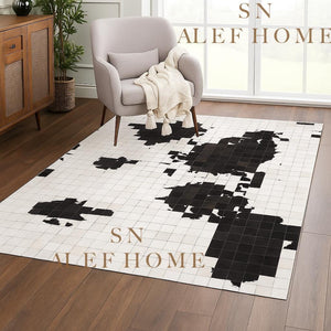 Black & White Cowhide Patchwork Rug – Handmade Hair-On Leather Carpet for Contemporary Home Décor