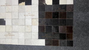 Black & White Cowhide Patchwork Rug – Handmade Hair-On Leather Carpet for Contemporary Home Décor - Alef home