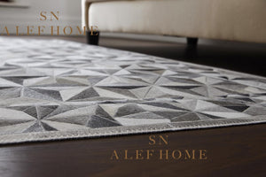Modern Grey Cowhide Patchwork Rug: Hair-On Leather Design - Alef home