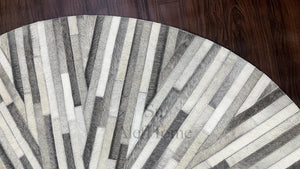 Handmade Starburst Cowhide Rug: Round Patchwork Leather Carpet with Wool Backing - Alef home