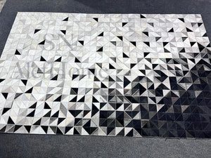 Large Black and White Cowhide Rug: Geometric Patchwork, Handmade 9.9x14 - Alef home
