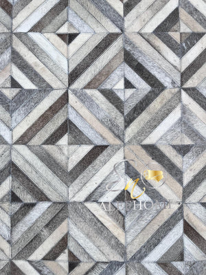 Handmade Grey Cowhide Patchwork Area Rug: Geometric Hair-On Leather Carpets For Home - Alef home