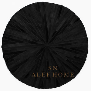 Handmade Black Cowhide Patchwork Rug: Hair-On Leather Carpet - Alef home