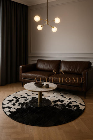 Handmade Cowhide Patchwork Rug: Round Black & White Leather Carpet - Alef home