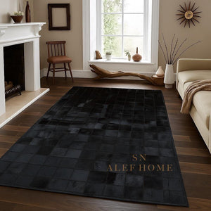 Black Cowhide Checkerboard Rug: Handmade Hair-On Leather Patchwork Carpet - Alef home