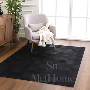 Handmade Black Cowhide Patchwork Rug: Modern Hair-On Leather Carpet - Alef home