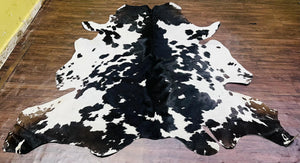 Handmade Black & White Cowhide Patchwork Rug: Hair-On Leather Carpet - Alef home