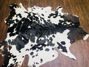 Handmade Black & White Cowhide Patchwork Rug: Hair-On Leather Carpet - Alef home