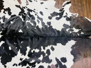 Handmade Black & White Cowhide Patchwork Rug: Hair-On Leather Carpet - Alef home