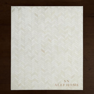 Handmade White Cowhide Rug: Chevron Patchwork, Hair-On Leather Carpet - Alef home