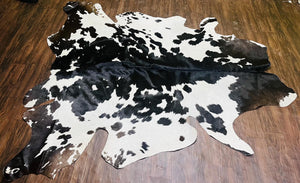 Handmade Black & White Cowhide Patchwork Rug: Hair-On Leather Carpet - Alef home