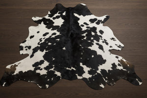 Handmade Black & White Cowhide Patchwork Rug: Hair-On Leather Carpet - Alef home