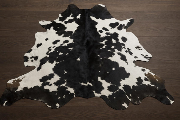 Handmade Black & White Cowhide Patchwork Rug: Hair-On Leather Carpet - Alef home