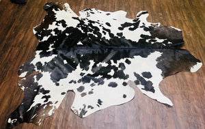 Handmade Black & White Cowhide Patchwork Rug: Hair-On Leather Carpet - Alef home