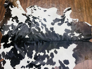 Handmade Black & White Cowhide Patchwork Rug: Hair-On Leather Carpet - Alef home