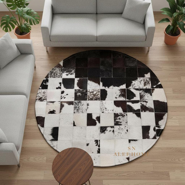 Handmade Cowhide Patchwork Rug: Round Black & White Leather Carpet - Alef home